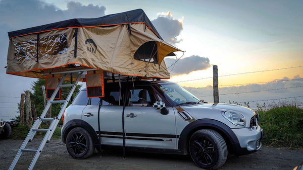 Wanaka 3 Person Roof Top Tent Setup With Annex on top of a mini cooper